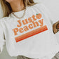 “JUST PEACHY” GRAPHIC TEE