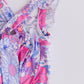 Sweet Springtime Ruffle Cross Back Romper