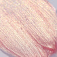 Macro swatch of pink lip gloss with gold shimmers - Instant Crush - Rich Rich - Half Caked
