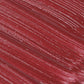 Close-up of Lip Fondant Liquid Lipstick in a vibrant deep red shade with a smooth, glossy texture.